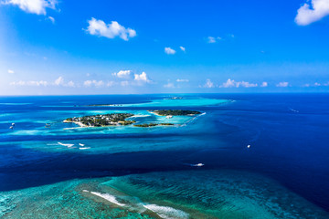 Naklejka na ściany i meble Aerial view, Maldives island Kandooma and Guraidhoo lagoon, South Male Atoll, Maldives
