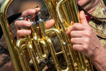hands playing trombone
