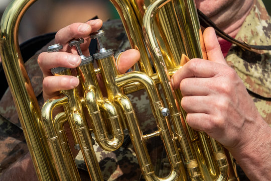 hands playing trombone