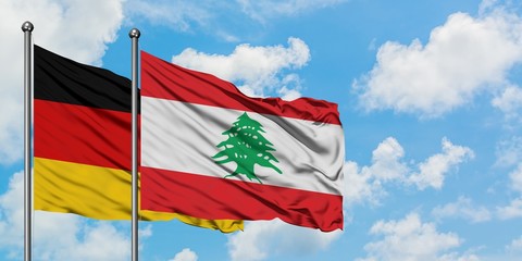 Germany and Lebanon flag waving in the wind against white cloudy blue sky together. Diplomacy concept, international relations.