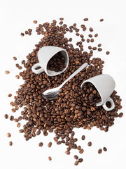 Coffee cup and spilled coffee beans 