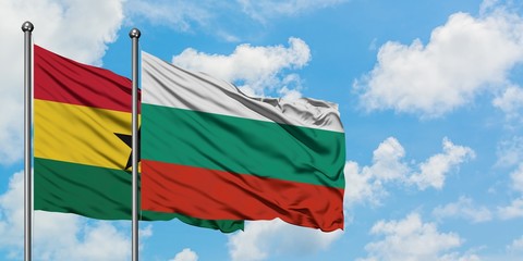 Ghana and Bulgaria flag waving in the wind against white cloudy blue sky together. Diplomacy concept, international relations.