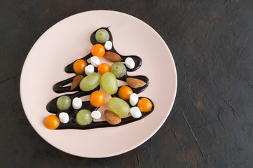 The dessert of berries with a chocolate topping.