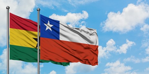 Ghana and Chile flag waving in the wind against white cloudy blue sky together. Diplomacy concept, international relations.