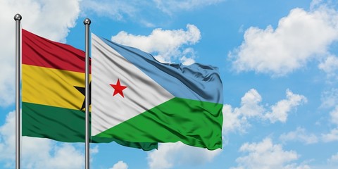 Ghana and Djibouti flag waving in the wind against white cloudy blue sky together. Diplomacy concept, international relations.