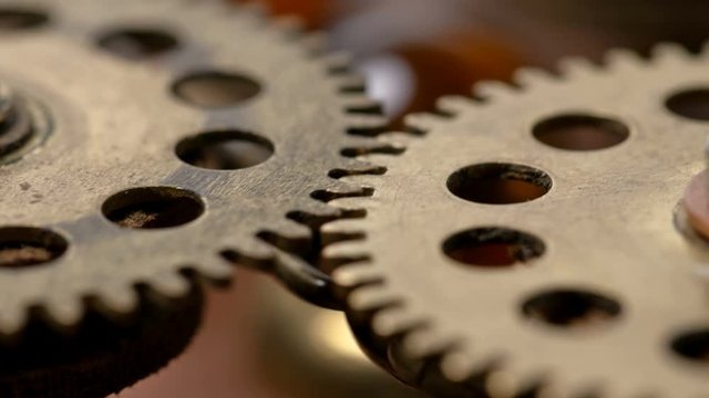 close-up spinning gears, Very similar to a clock mechanism or a working device in the old style. 4K
