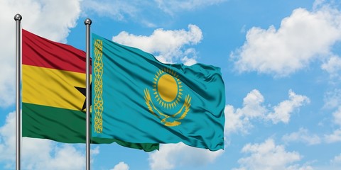 Ghana and Kazakhstan flag waving in the wind against white cloudy blue sky together. Diplomacy concept, international relations.