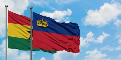 Ghana and Liechtenstein flag waving in the wind against white cloudy blue sky together. Diplomacy concept, international relations.
