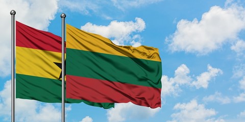 Ghana and Lithuania flag waving in the wind against white cloudy blue sky together. Diplomacy concept, international relations.