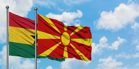 Ghana and Macedonia flag waving in the wind against white cloudy blue sky together. Diplomacy concept, international relations.