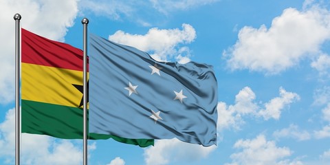 Ghana and Micronesia flag waving in the wind against white cloudy blue sky together. Diplomacy concept, international relations.