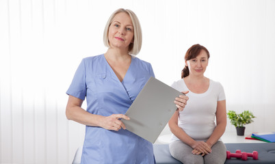 Female patient being reassured by doctor in hospital. Health recovery concept