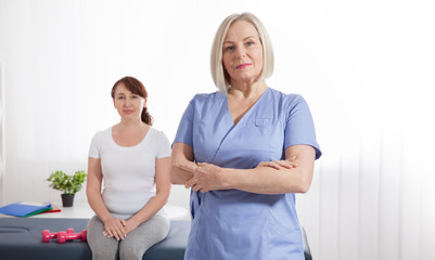 Female patient being reassured by doctor in hospital. Health recovery concept