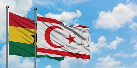 Ghana and Northern Cyprus flag waving in the wind against white cloudy blue sky together. Diplomacy concept, international relations.