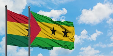 Ghana and Sao Tome And Principe flag waving in the wind against white cloudy blue sky together. Diplomacy concept, international relations.