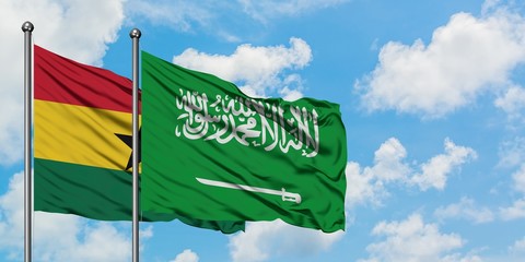 Ghana and Saudi Arabia flag waving in the wind against white cloudy blue sky together. Diplomacy concept, international relations.