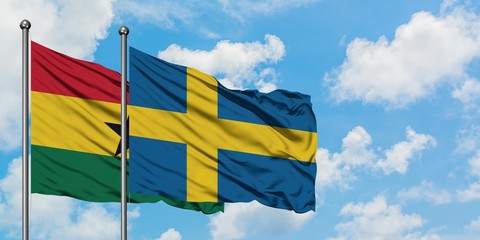 Ghana and Sweden flag waving in the wind against white cloudy blue sky together. Diplomacy concept, international relations.