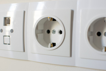 electric socket on the white wall