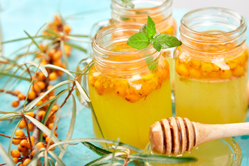 Vitaminic healthy sea buckthorn tea with ginger and honey and sea buckthorn berries