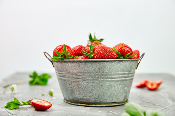 Ripe red strawberries on black table, Strawberries in white bowl. Fresh strawberries. grey strawberries. Diet food. Healthy, vegan. Close up. Copy space.