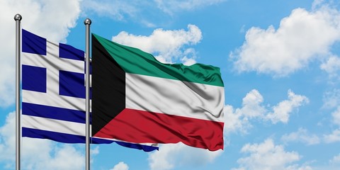 Greece and Kuwait flag waving in the wind against white cloudy blue sky together. Diplomacy concept, international relations.