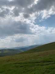 Obraz na płótnie Canvas mountain landscape with fluffy clouds