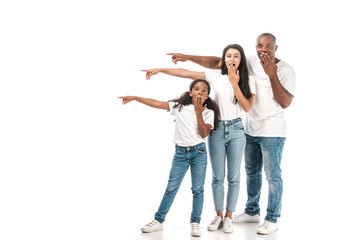 shocked african american parents pointing with fingers and covering mouths with hands on white background