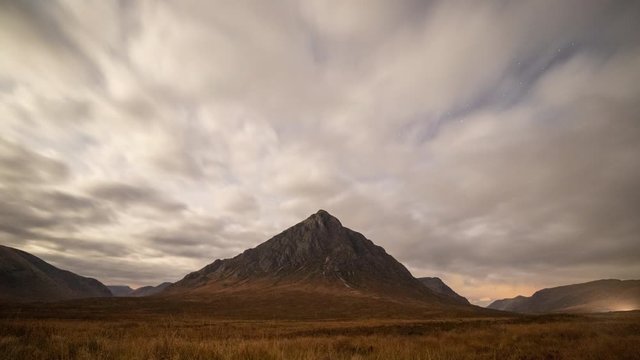 time lapse astro photography on rannoch moor facing buchaille etive mor in the argyll region of the highlands of scotland on a bright moon lit night