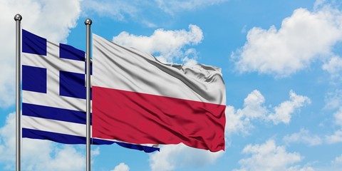 Greece and Poland flag waving in the wind against white cloudy blue sky together. Diplomacy concept, international relations.