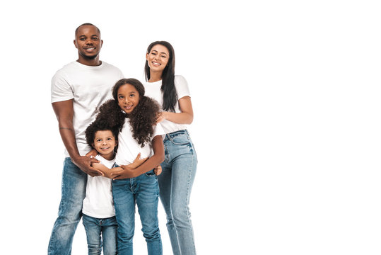 happy african american parents with daughter and son smiling at camera while standing isolated on white