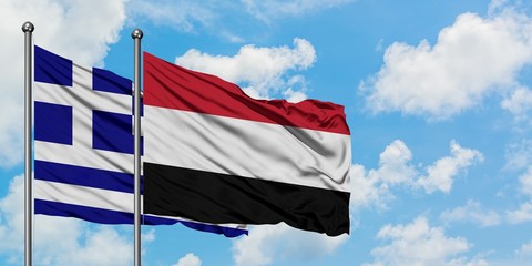 Greece and Yemen flag waving in the wind against white cloudy blue sky together. Diplomacy concept, international relations.