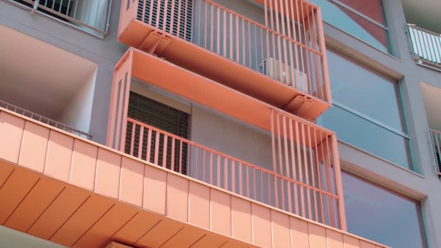Beautiful new condos from outside 4K. Low angle long shot of driving by the new condos in focus.