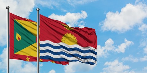 Grenada and Kiribati flag waving in the wind against white cloudy blue sky together. Diplomacy concept, international relations.
