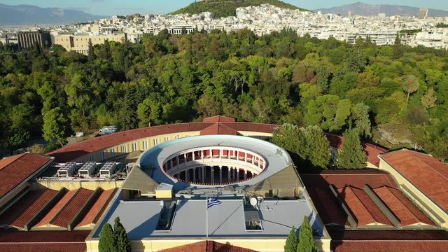 Aerial drone video of renovated public neoclassic building facade of Zappeion used for events and meetings in the National Gardens of Athens, Greece
