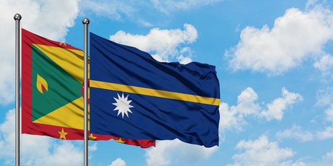 Grenada and Nauru flag waving in the wind against white cloudy blue sky together. Diplomacy concept, international relations.