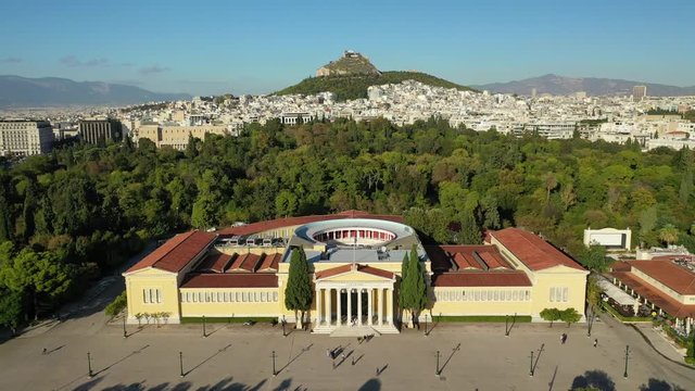 Aerial drone video of renovated public neoclassic building facade of Zappeion used for events and meetings in the National Gardens of Athens, Greece