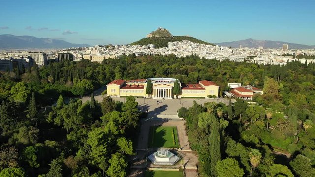 Aerial drone video of renovated public neoclassic building facade of Zappeion used for events and meetings in the National Gardens of Athens, Greece
