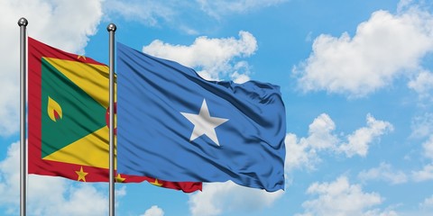 Fototapeta premium Grenada and Somalia flag waving in the wind against white cloudy blue sky together. Diplomacy concept, international relations.