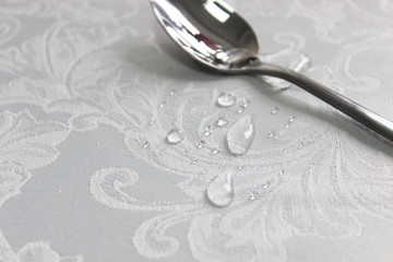 drops of water in a clean spoon, drops on fabric