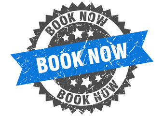 book now grunge stamp with blue band. book now