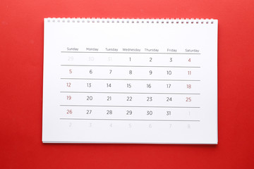 Planning calendar on a red background. Important date. Place for text. Planning concept.