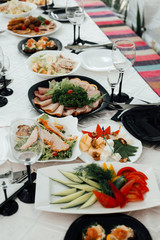 A lot of various meal on a banquet table. Festively served table at restaurant for a banquet. The party - on a table a lot of various meal is necessary.
