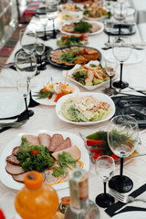 A lot of various meal on a banquet table. Festively served table at restaurant for a banquet. The party - on a table a lot of various meal is necessary.