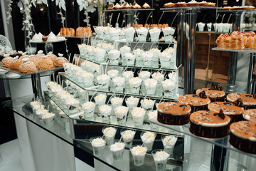 Candy Bar. Birthday table decoration. Candy bar for party. Dessert table for a party. Cake, cupcakes, sweetness. Elegant and luxurious event arrangement.  Luxury life. Delicious sweets on candy buffet