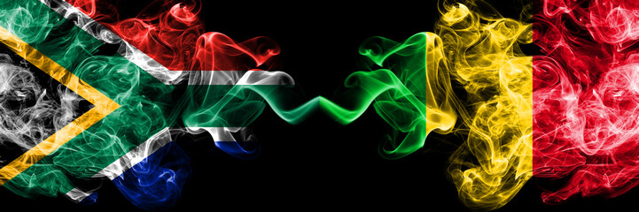 Obraz premium South Africa vs Mali smoky mystic flags placed side by side. Thick colored silky abstract smoke flags concept