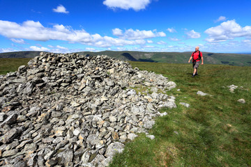 Walker, Summit cairn on Selside Fell, Mardale Common, Lake District National Park, Cumbria County, England, UK