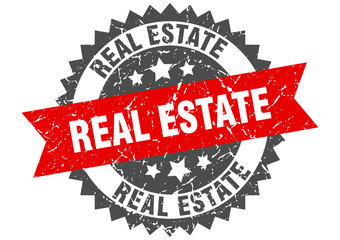 real estate grunge stamp with red band. real estate