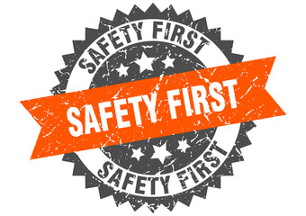 safety first grunge stamp with orange band. safety first