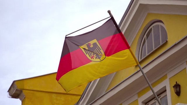 German flag with coat of arms at German Embassy.