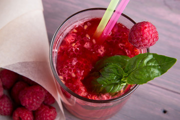 Glass of fresh strawberry summer cocktail and strawberries on the wooden background. Healthy food...